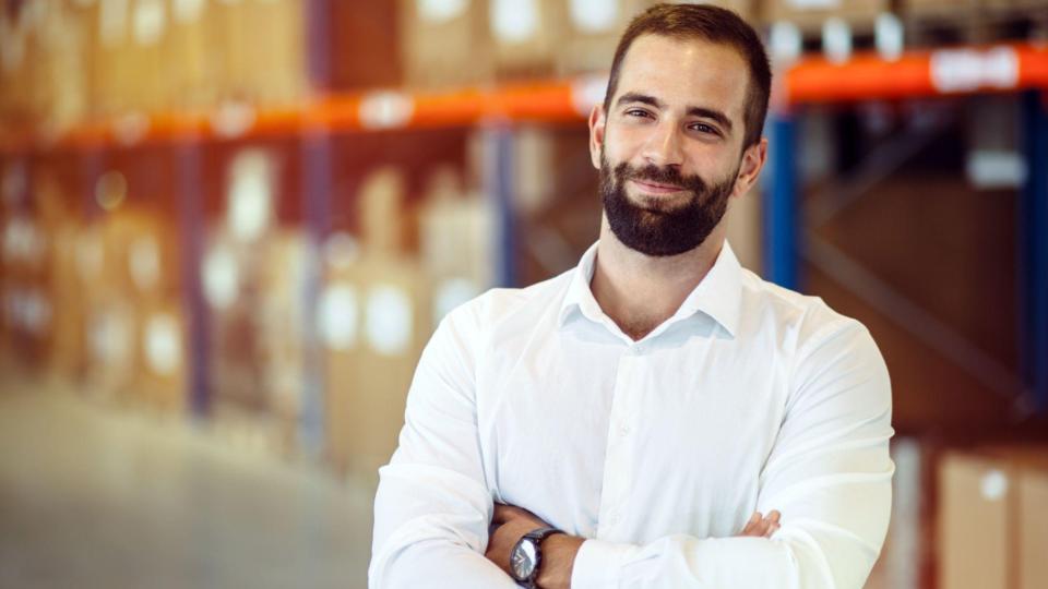 salesperson stands in a warehouse