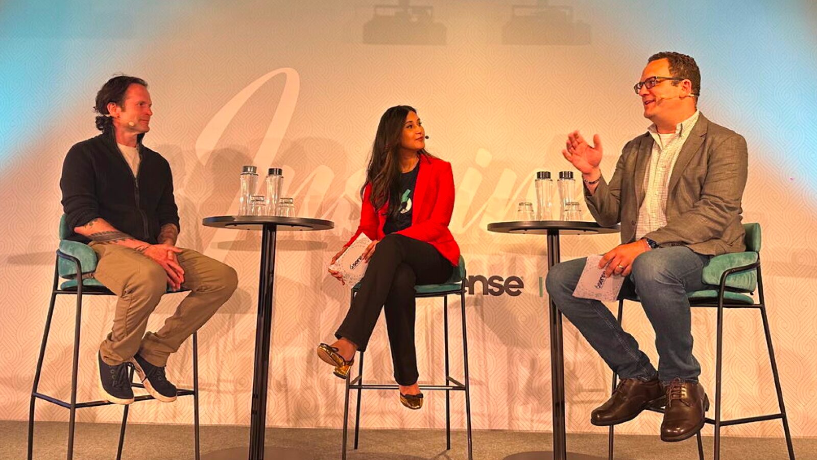 Aaron Ross, Saima Rashid, and Adam Kaiser host a live Revenue Makers podcast from the Inspire UK stage.
