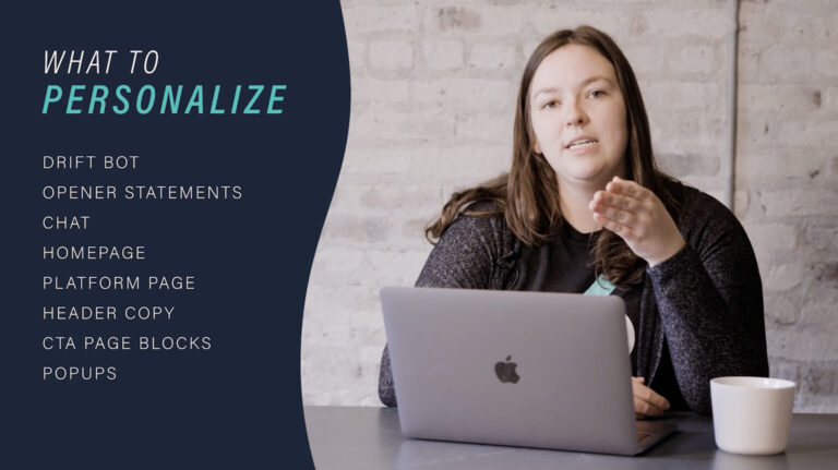 woman sitting at desk with laptop talking to camera