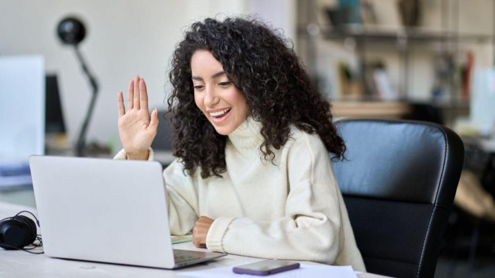 a sales rep smiles during a Zoom call