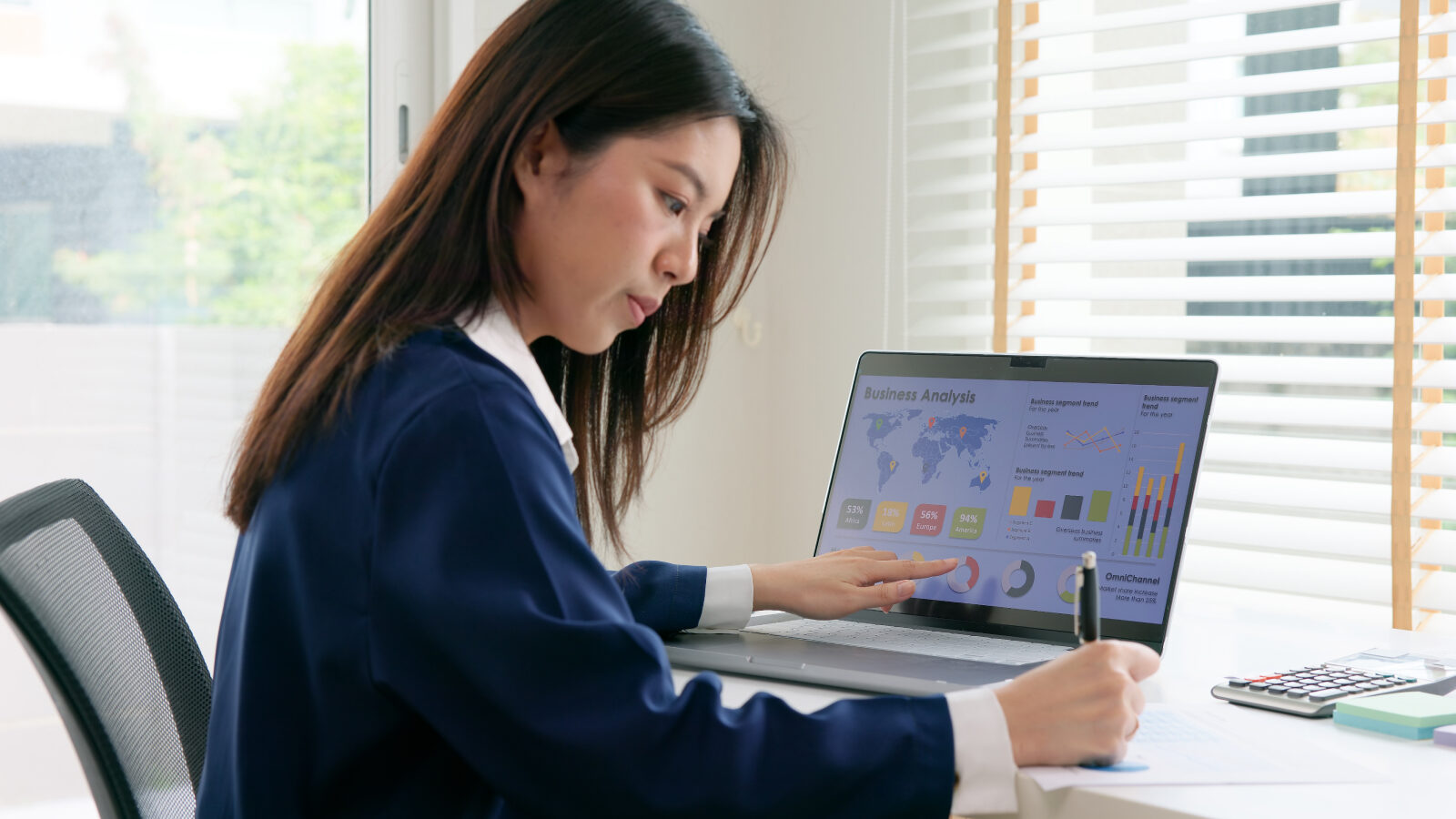 Woman reviews data on a laptop screen to better understand prospects.